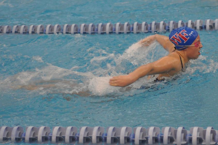 Junior Laurel York swims butterfly in the 200 Individual Medley.