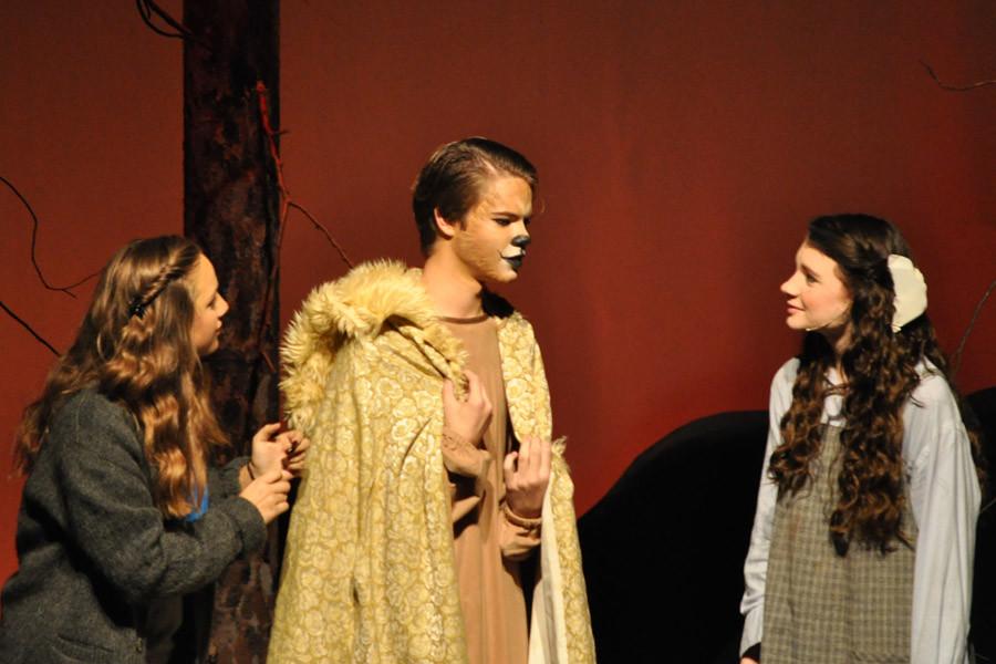 Sophomore April Houghland (right) as Lucy Pevensie and freshman Carly Hebert (left) listen to the character of Aslan. 