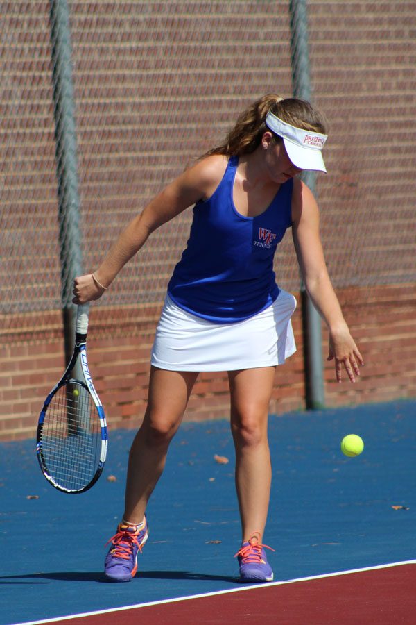 Senior+Sara+Brooks%2C+half+of+the+qualifying+doubles+team%2C+serves+at+a+home+match.+Brooks+moved+to+N.C.+her+senior+year.+