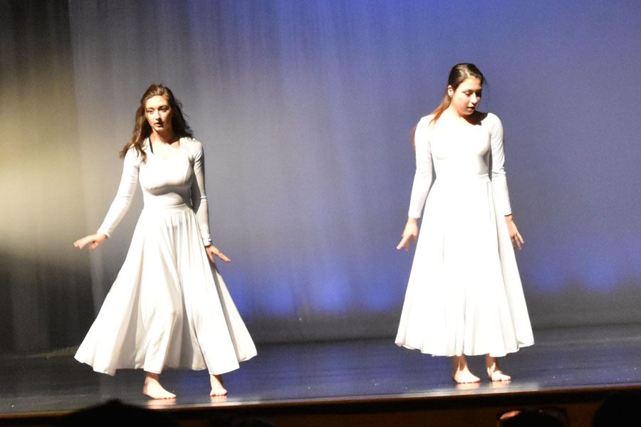 Juniors Hailey Germann (left) and Rachel Cheeseman (right) perform during the May 11 dance concert. Cheeseman favors lyrical and contemporary dance while Germann cites modern dance as her favorite. 