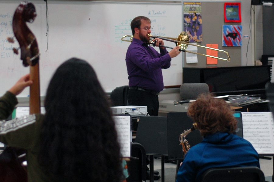 Martel leads his instrumental music class. 