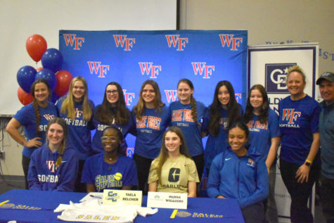 Williams, center, poses with teammates and coaches Feb. 1.